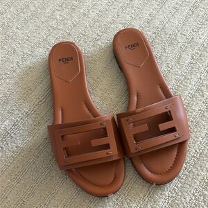 FENDI
Baguette FF Tube Medallion Flat Sandals